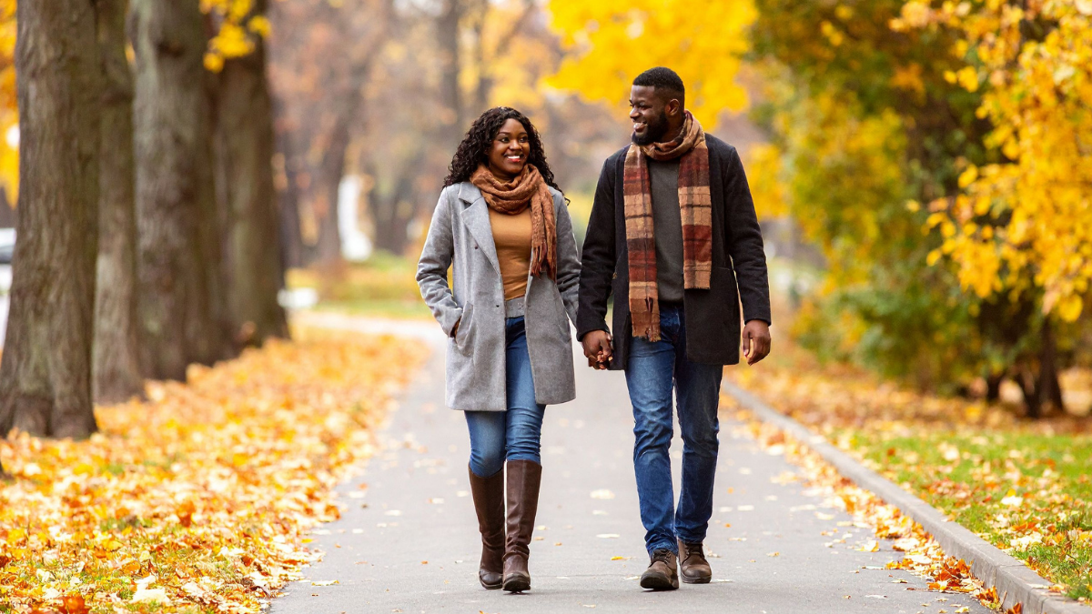 Success on a First Date seen by happy couple walking through park