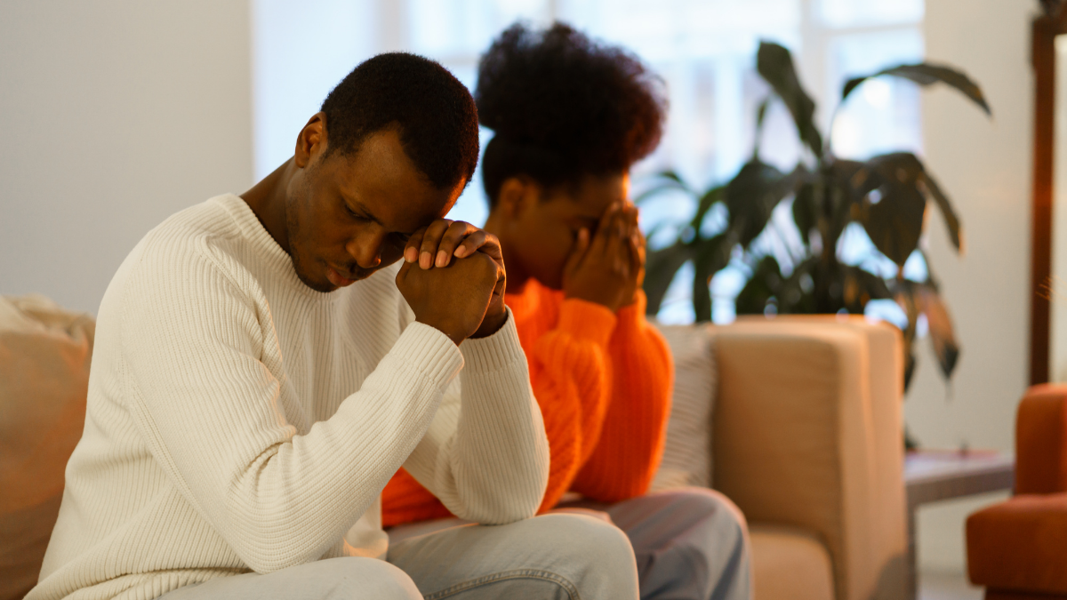 Couple sit upset while working on how to repair a relationship